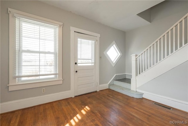 entryway featuring dark hardwood / wood-style floors and a wealth of natural light