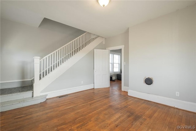 spare room featuring hardwood / wood-style flooring