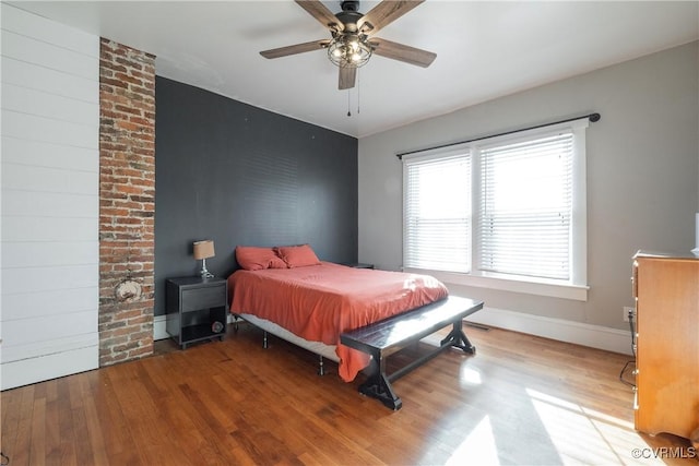 bedroom featuring ceiling fan and wood-type flooring