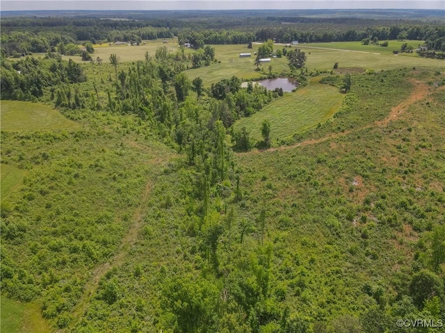 birds eye view of property featuring a water view and a rural view