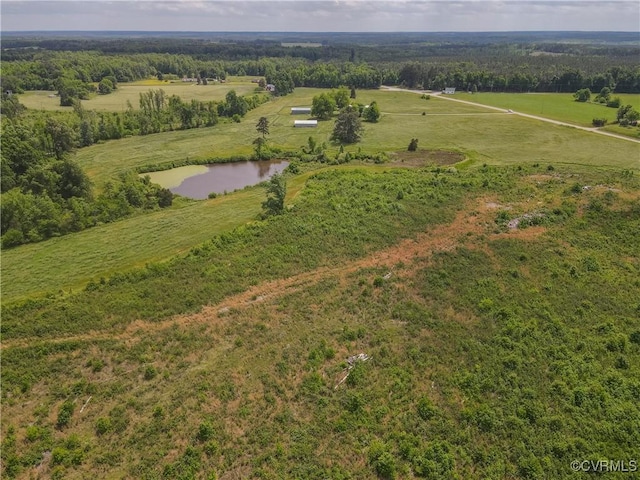 birds eye view of property featuring a rural view and a water view