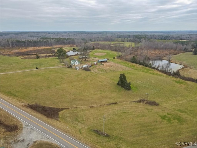 birds eye view of property with a rural view and a water view