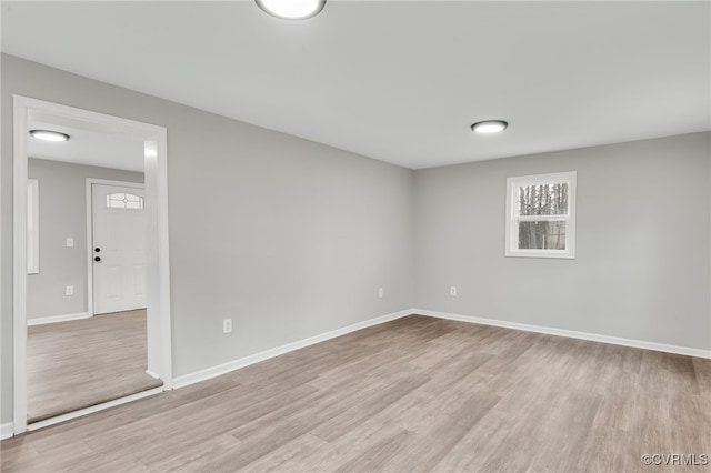 unfurnished room with light hardwood / wood-style flooring