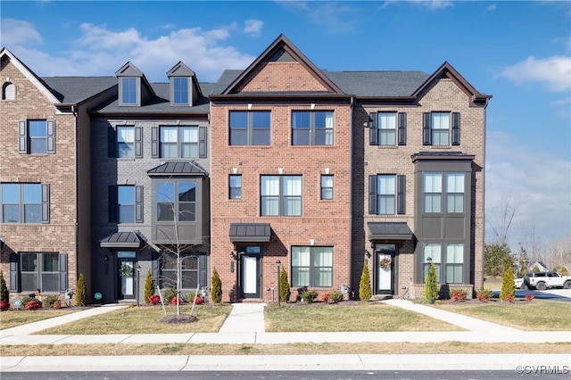 view of property featuring brick siding