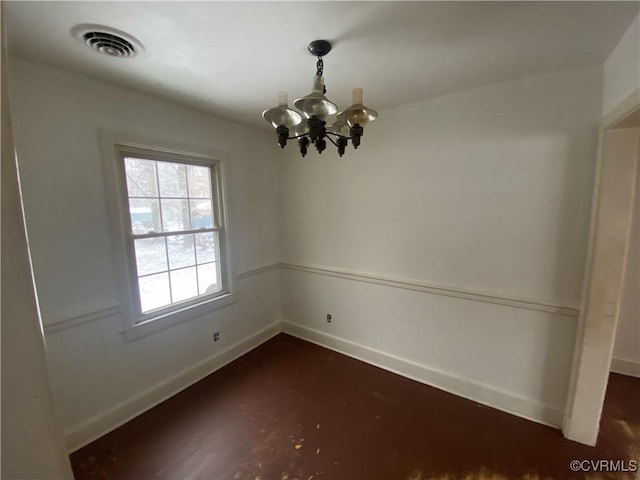 unfurnished dining area featuring an inviting chandelier