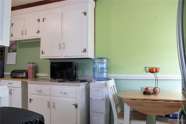 kitchen featuring white cabinetry and light countertops