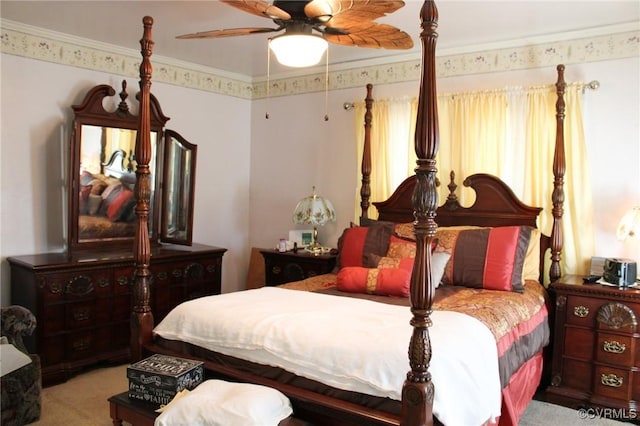 carpeted bedroom featuring crown molding and ceiling fan