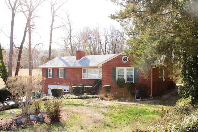 back of property featuring crawl space, brick siding, and a chimney