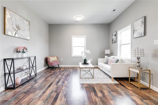 living room with dark hardwood / wood-style flooring