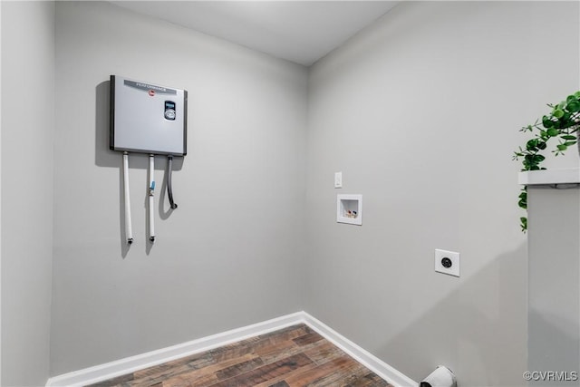 washroom with hookup for an electric dryer, washer hookup, and dark hardwood / wood-style flooring