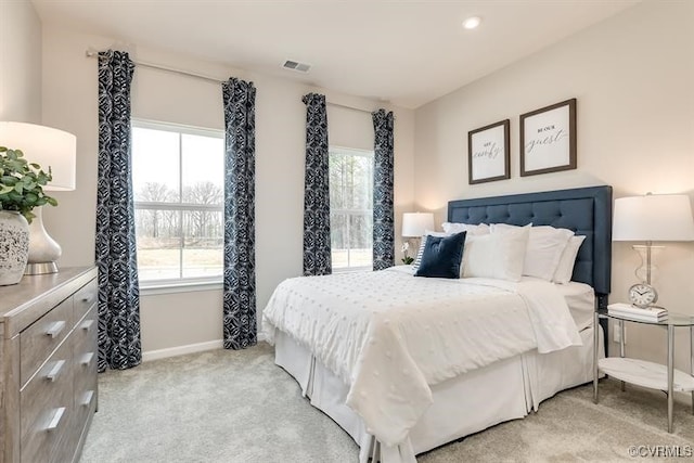 bedroom featuring light colored carpet