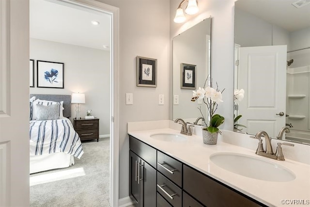 bathroom with vanity and  shower combination