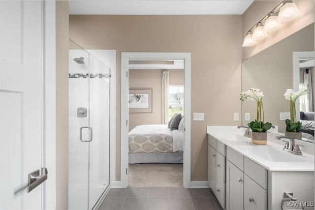 bathroom with walk in shower, tile patterned flooring, and vanity