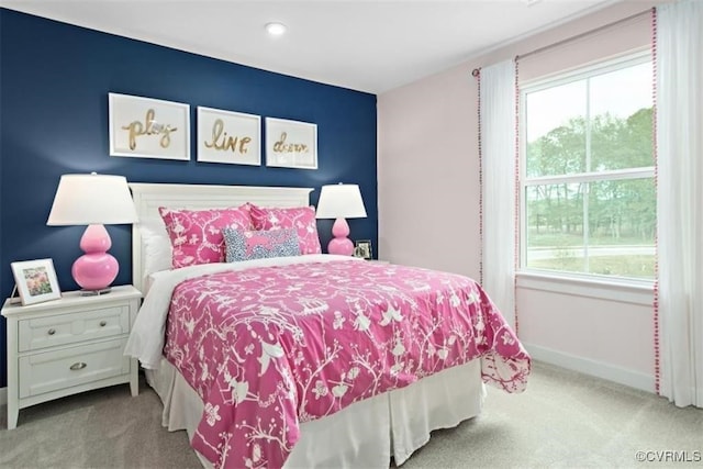 bedroom featuring light colored carpet