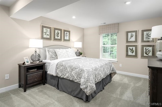 bedroom with light colored carpet