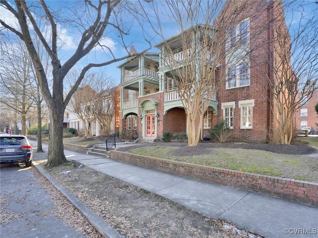 view of front of property with a balcony