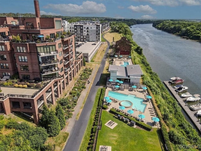 birds eye view of property with a water view