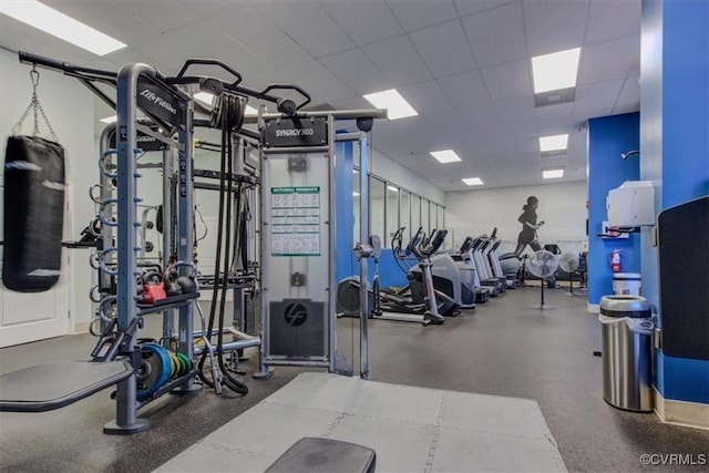 exercise room with a drop ceiling