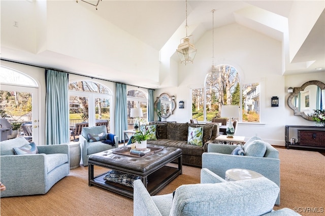 living room with high vaulted ceiling