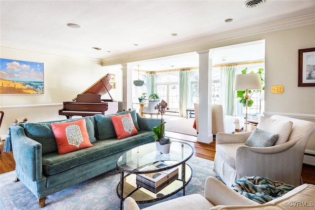 living room featuring ornamental molding, decorative columns, and wood-type flooring