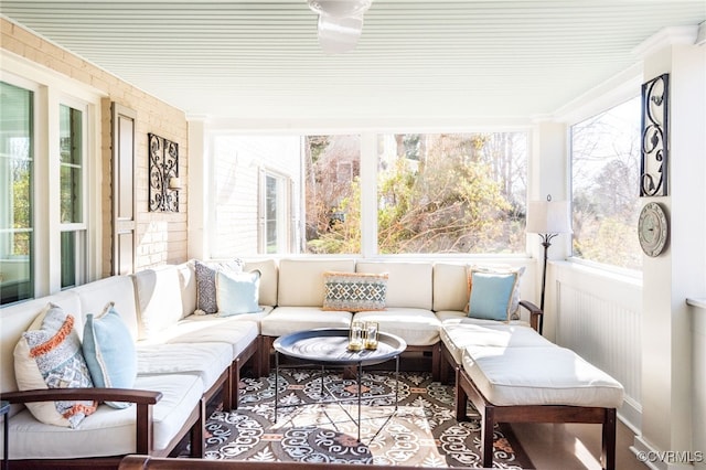 sunroom / solarium featuring breakfast area