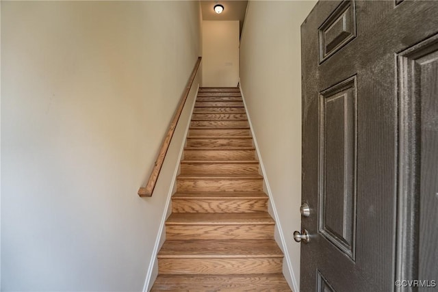 stairway featuring hardwood / wood-style flooring