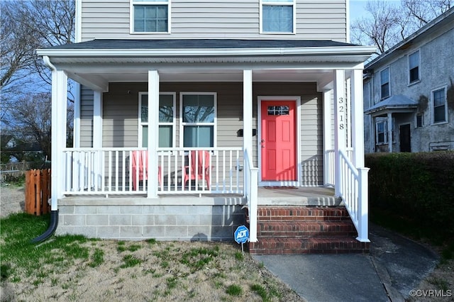 view of front of property featuring covered porch