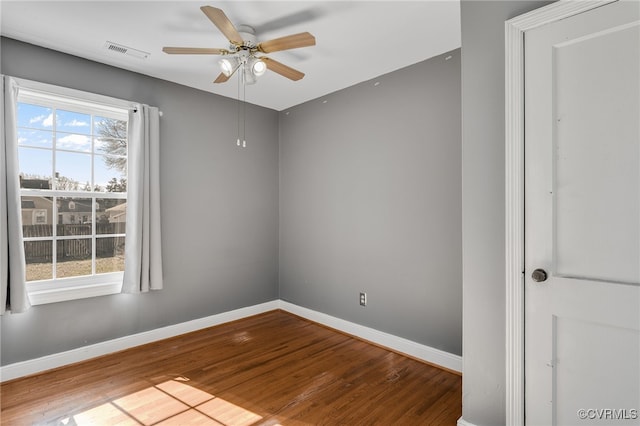 unfurnished room with hardwood / wood-style floors and ceiling fan