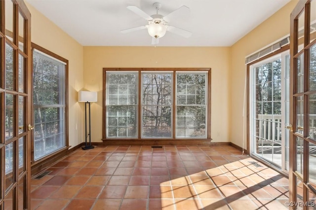 entryway with ceiling fan, baseboards, visible vents, and tile patterned floors