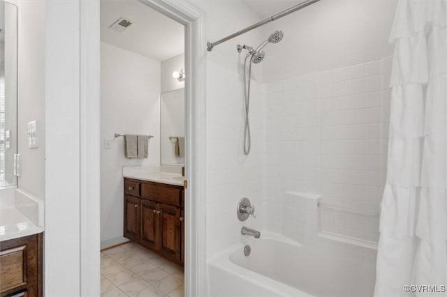 full bathroom featuring visible vents, marble finish floor, shower / bath combo, and vanity