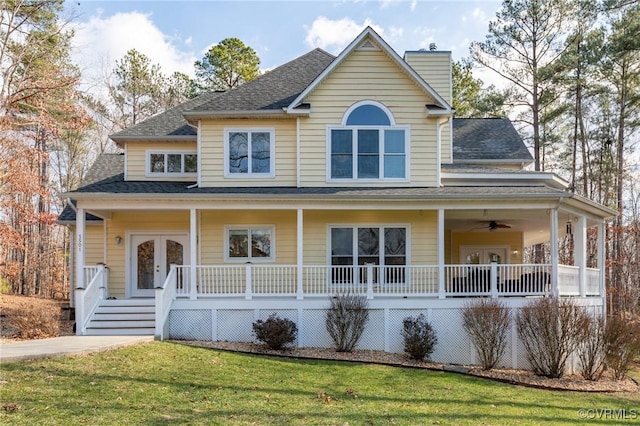 country-style home featuring ceiling fan, a front lawn, a porch, and french doors