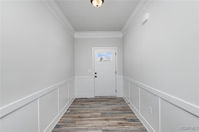 doorway to outside with crown molding and wood-type flooring