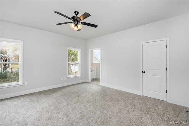 empty room featuring carpet flooring and ceiling fan