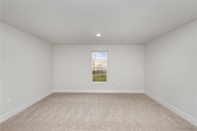 spare room featuring carpet flooring