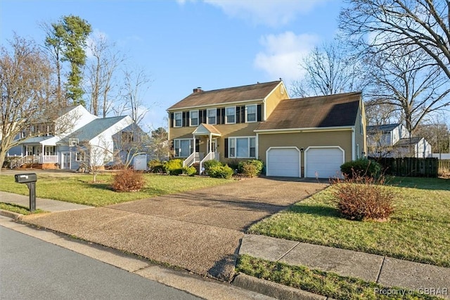 colonial house with a front lawn and a garage