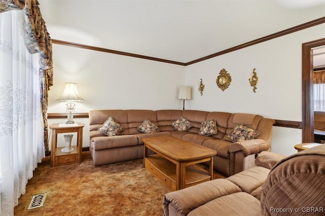 carpeted living room featuring ornamental molding