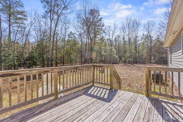 wooden terrace featuring central AC unit