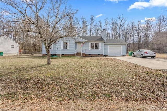 view of front of house featuring a front yard and a garage