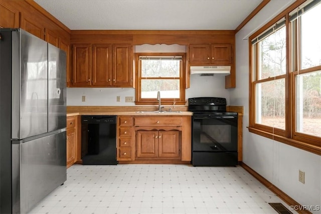 kitchen featuring sink and black appliances