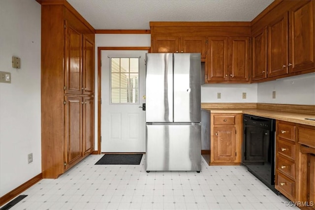 kitchen featuring stainless steel refrigerator and black dishwasher