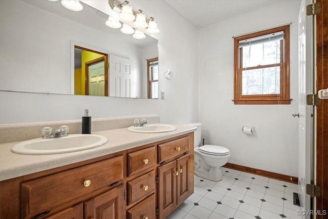 bathroom featuring toilet and vanity