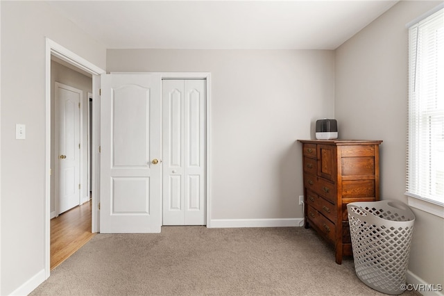 carpeted bedroom featuring a closet