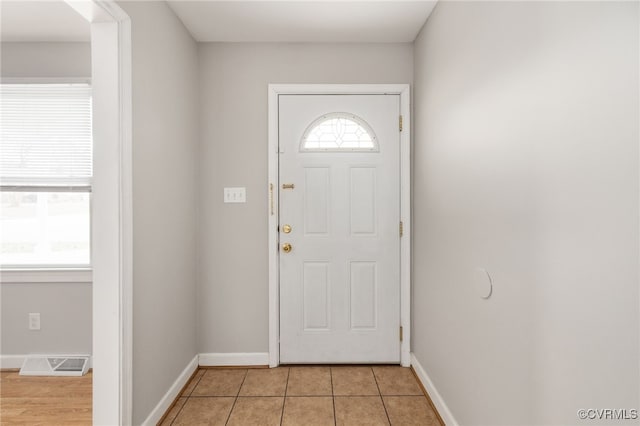 foyer entrance featuring light tile patterned floors