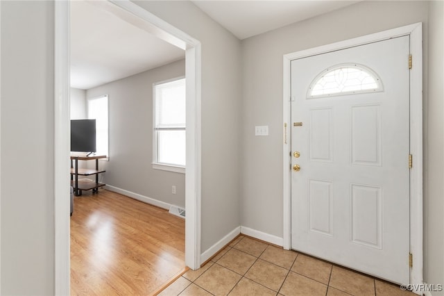 foyer featuring light tile patterned floors