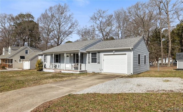 single story home featuring covered porch, a garage, and a front lawn