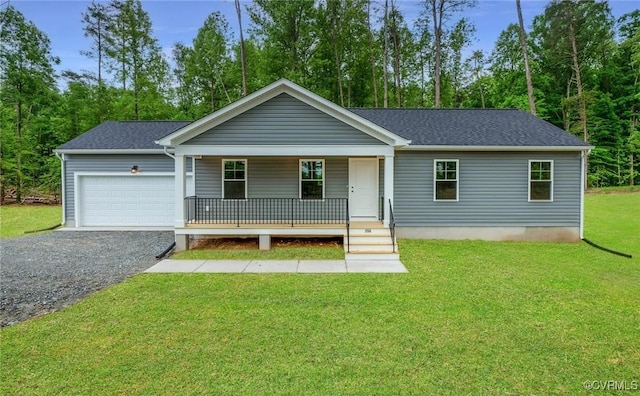 single story home featuring a garage, covered porch, and a front yard