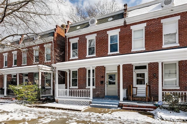 townhome / multi-family property featuring brick siding