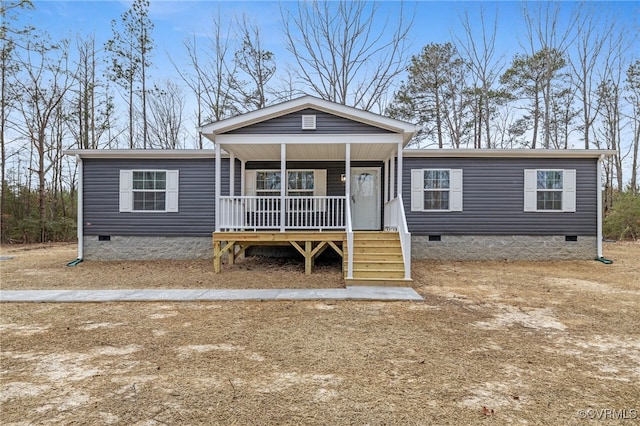 manufactured / mobile home featuring crawl space and covered porch