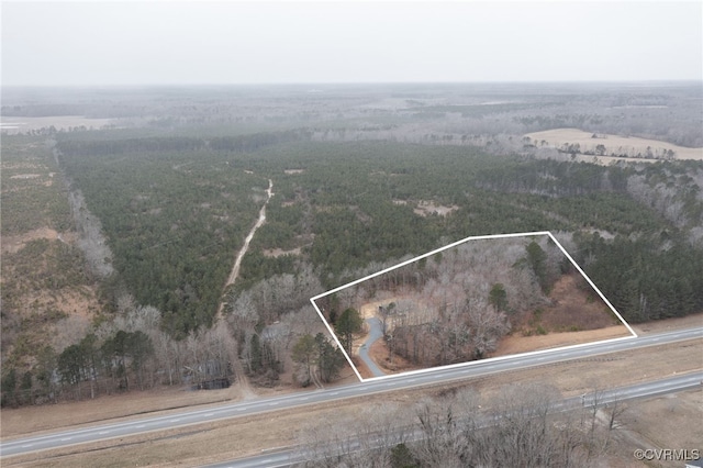 birds eye view of property featuring a rural view