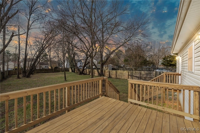 deck at dusk with a lawn